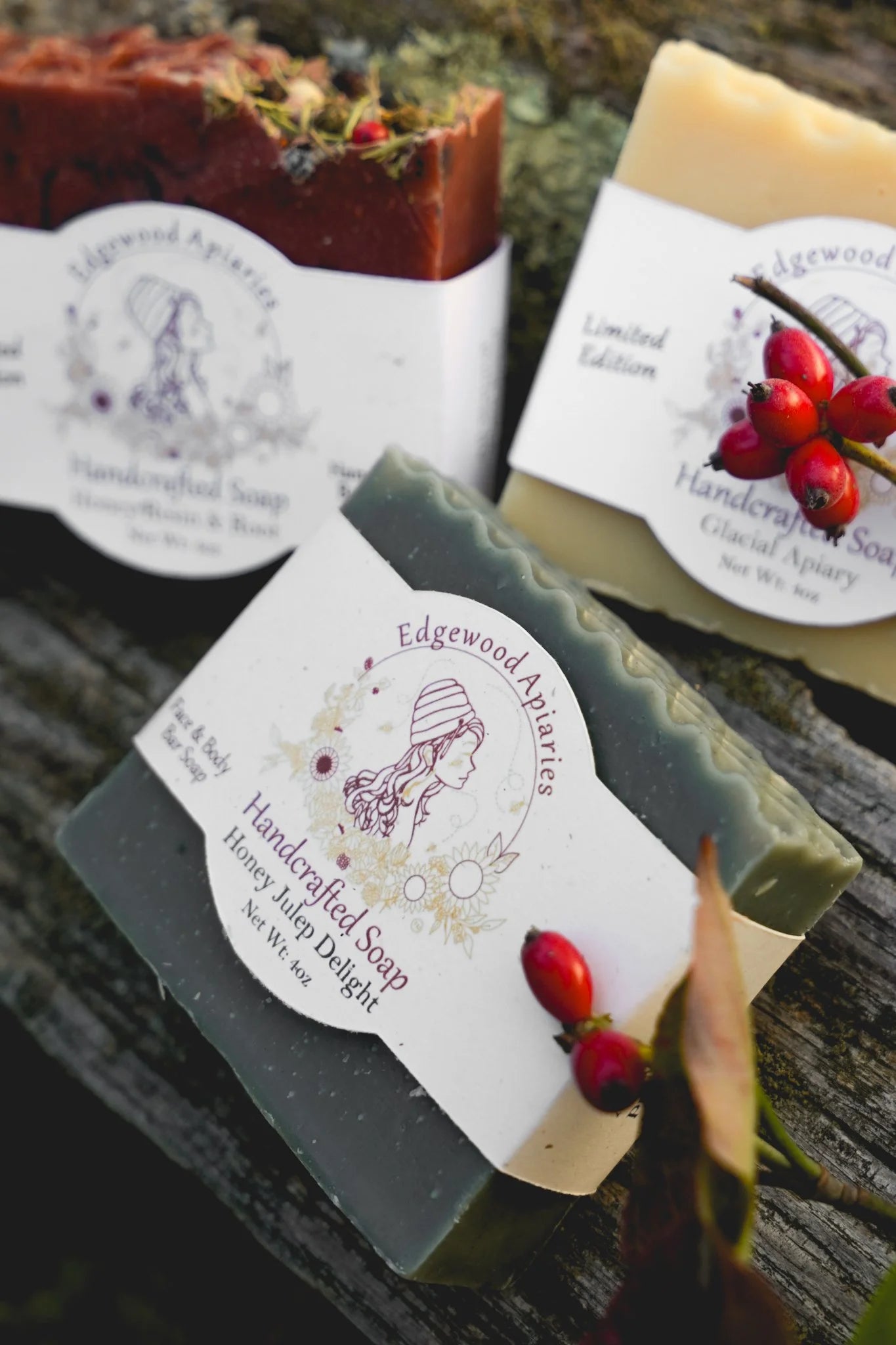 Edgewood Apiaries Honey Julep Delight Handcrafted Soap Bar on a wooden background with festive berries
