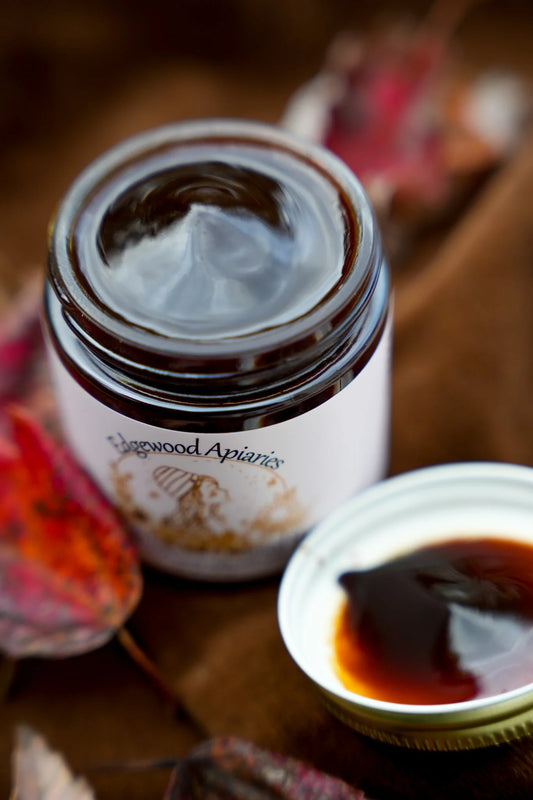 Edgewood Apiaries Chocolate Creamed Honey on a fall background