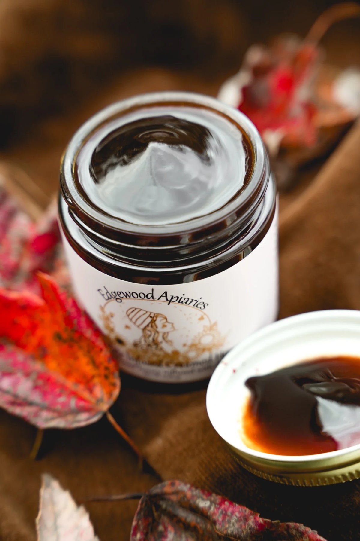 Edgewood Apiaries Chocolate Creamed Honey on a fall background