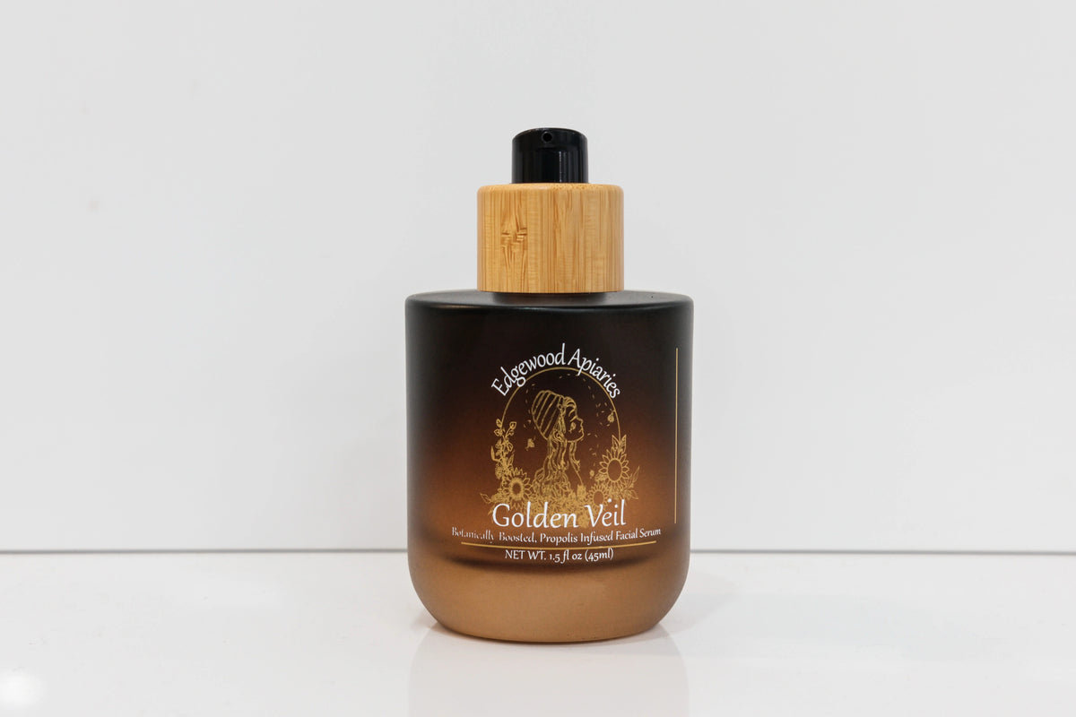 Edgewood Apiaries Golden Veil propolis infused facial serum in an amber glass bottle with bamboo pump, 1.5 fl oz
